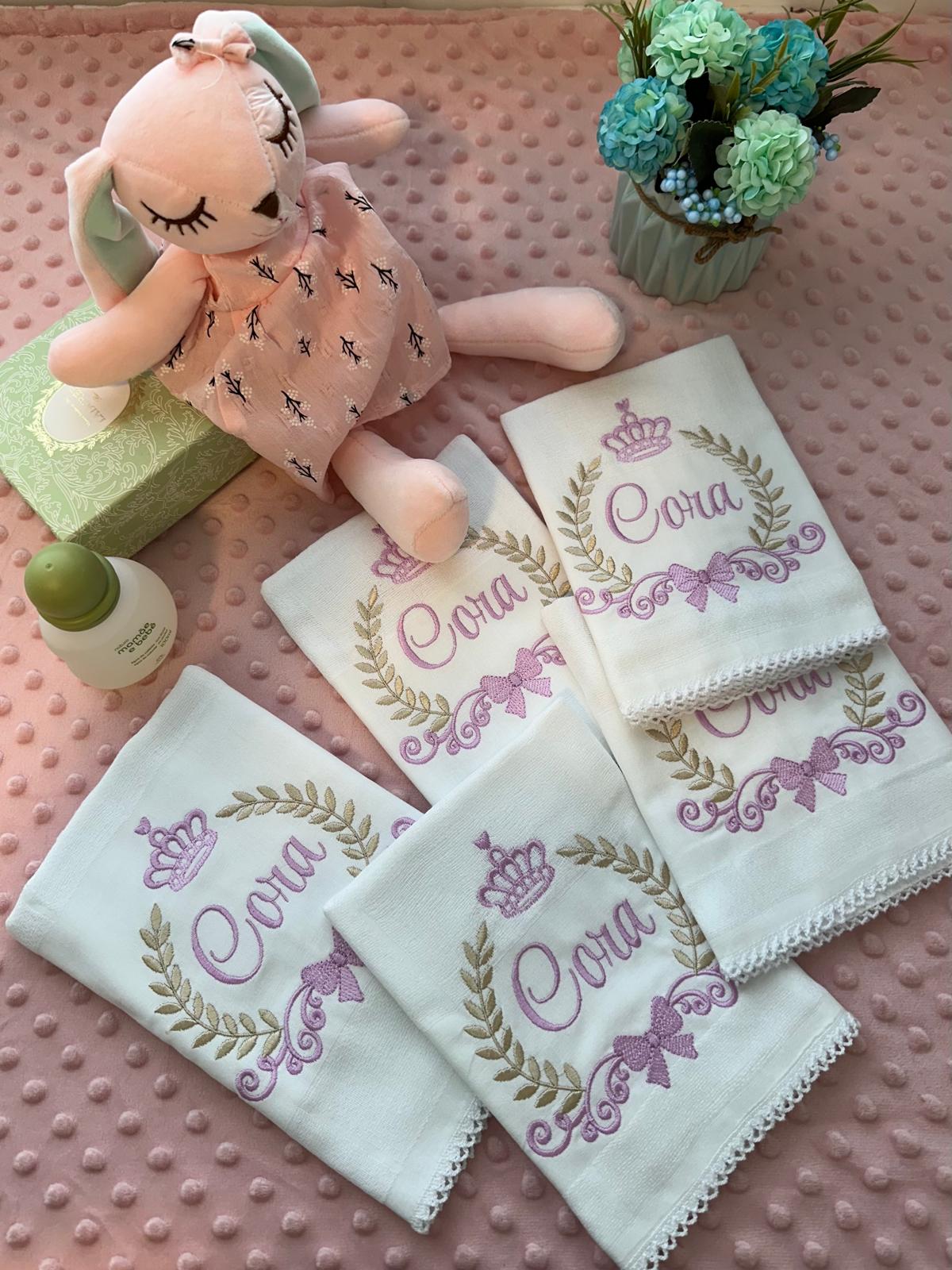 Cloth set embroidered with name Cora, crown and laurel wreath